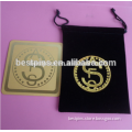 etched copper coaster with custom dollars logo and black velvet purse bag